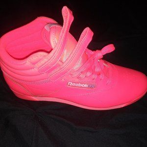 Like new neon orange Reebok hi top classics. Worn once. No flaws or marks.